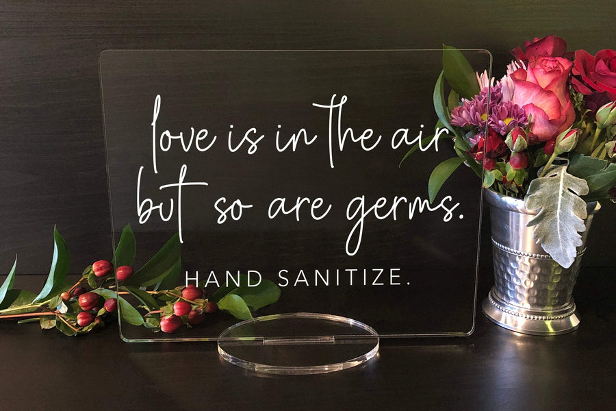 Elation Factory Co Weddings > Decorations > Signs Love is in the Air, but So Are Germs -Sanitize, Social Distancing Clear Acrylic Wedding or Business Event Sign, COVID 19 Safety
